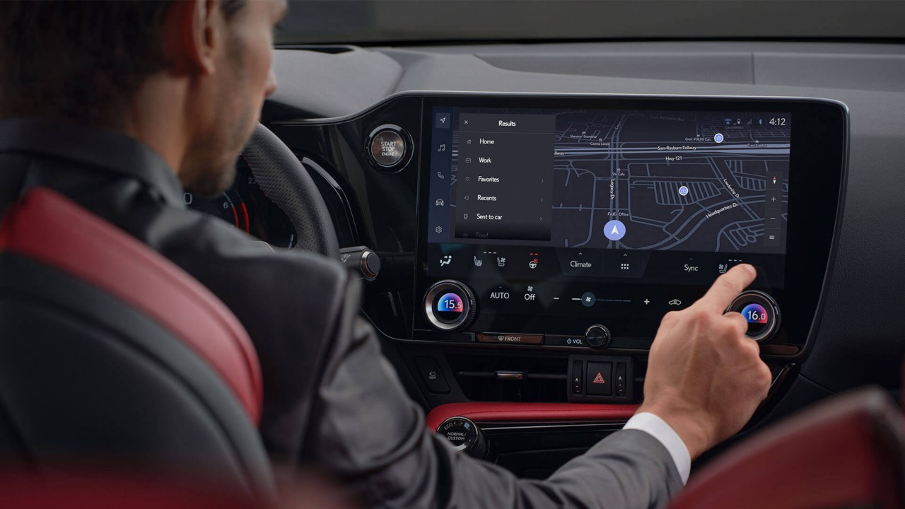 A man sat in a Lexus NX